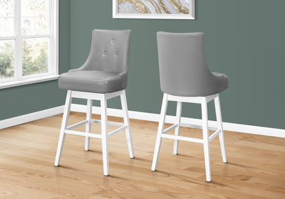 Set of Two 29" Gray and White Faux Leather and Solid Wood Bar Height Swivel Bar Chairs