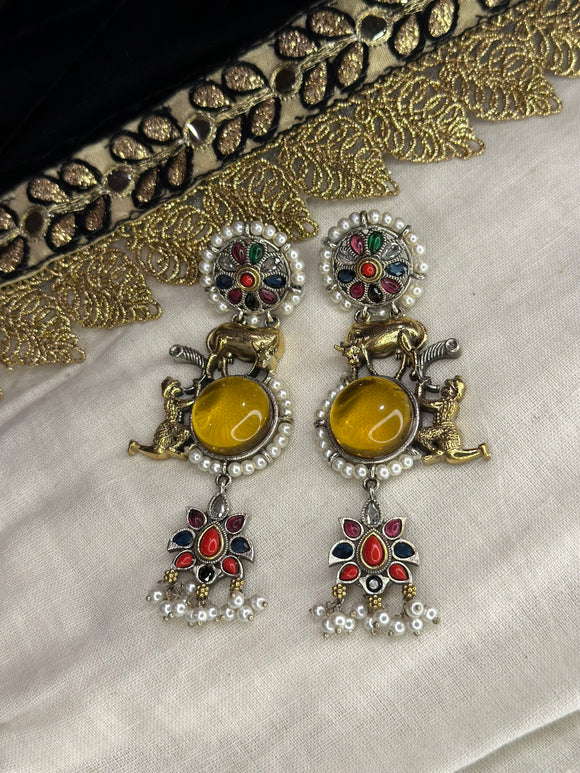 A multicolor pair of earrings adorned with gold and silver beads