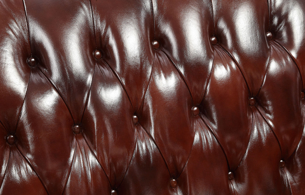 69" Brown And Walnut Top Grain Leather Curved Loveseat and Toss Pillows