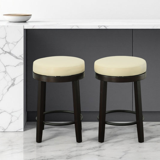 Set of Two 24" Cream and Espresso Faux Leather and Solid Wood Backless Counter Height Swivel Bar Chairs
