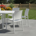 Set of Four White Heavy Duty Plastic Outdoor Stacking Dining Chairs