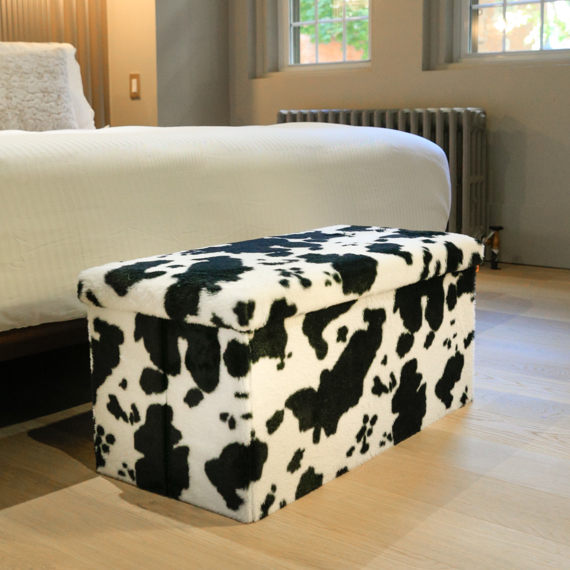 30" Plastic Cow Print Storage Ottoman