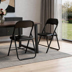 Set of Two Black Faux Leather and Steel Folding Chairs